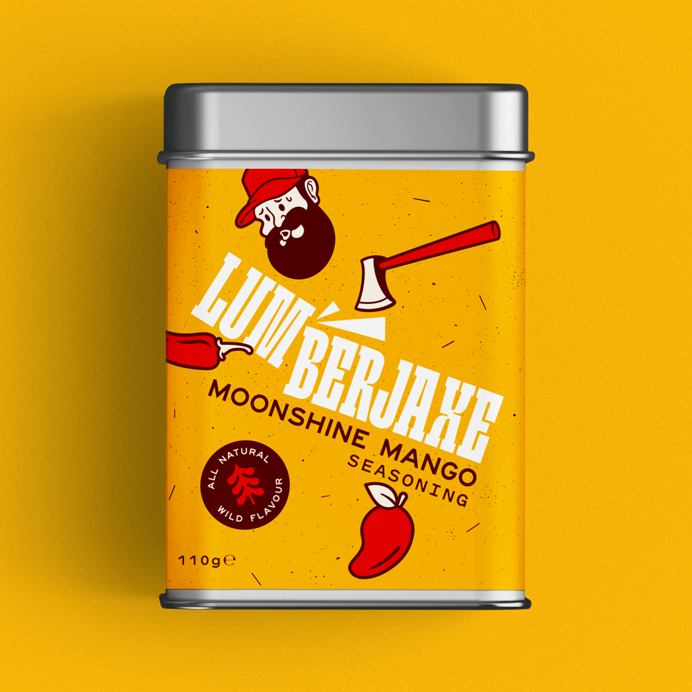 A tin container of 'Lumberjaxe Moonshine Mango Seasoning' displayed against a vibrant yellow background. The tin has a speckled yellow label featuring bold white typography with an axe graphic cutting through the text. The design includes a red circular badge that reads 'All Natural Wild Flavour,' a bearded lumberjack character in a red hat, and illustrations of a chili pepper and a mango. The seasoning weight is listed as 110g.