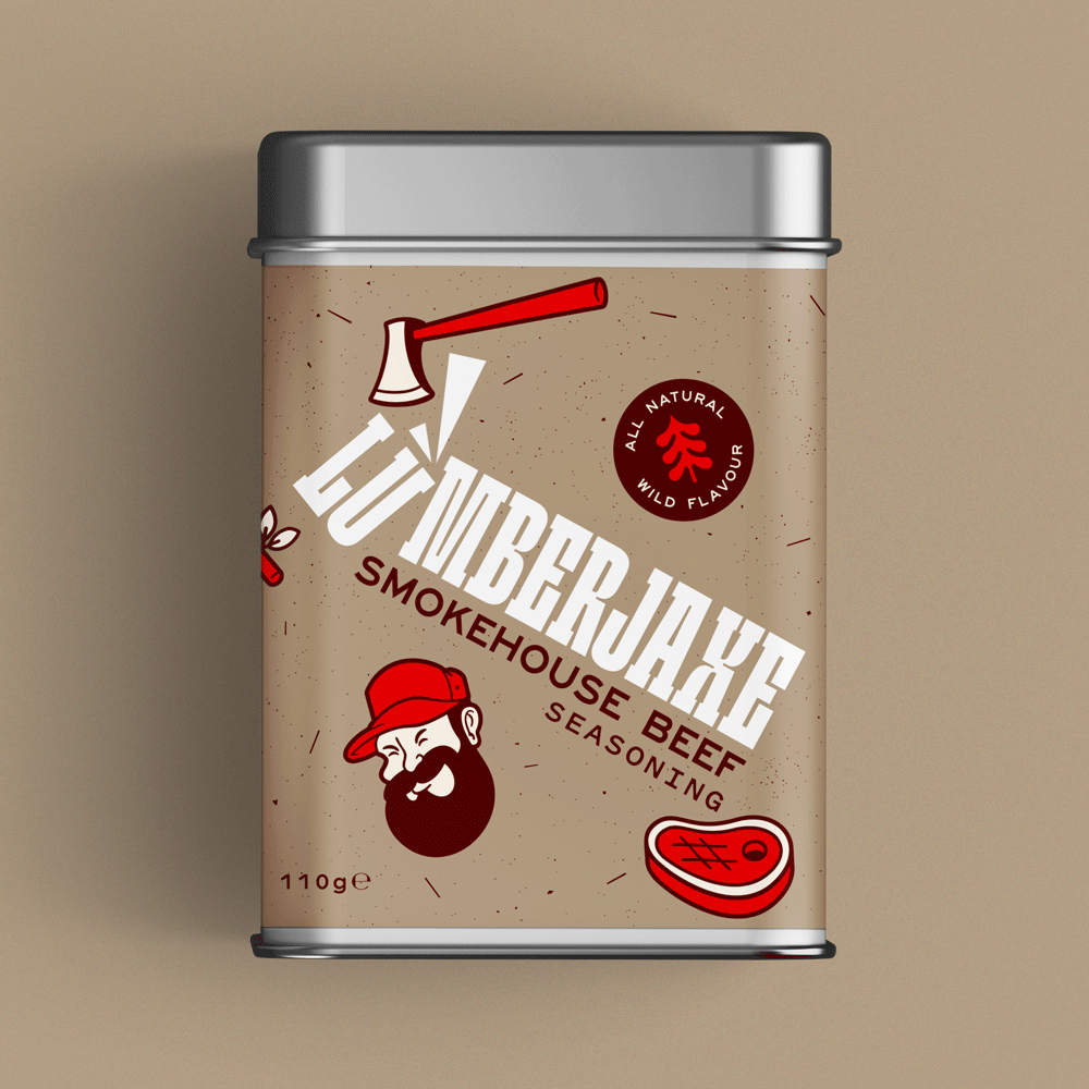 A tin container of 'Lumberjaxe Smokehouse Beef Seasoning' displayed against a neutral beige background. The tin has a rustic, speckled tan label featuring bold white typography with an axe graphic cutting through the text. The design includes a red circular badge that reads 'All Natural Wild Flavour,' a bearded lumberjack character wearing a red hat, and an illustration of a grilled steak. The seasoning weight is listed as 110g.